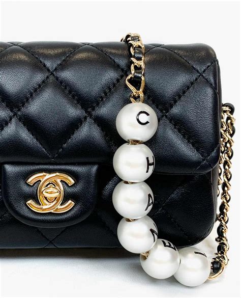 pink chanel pearl bag|Chanel bag with pearl chain.